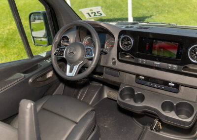 Black interior dashboard of a Mercedes-Benz specialty vehicle.