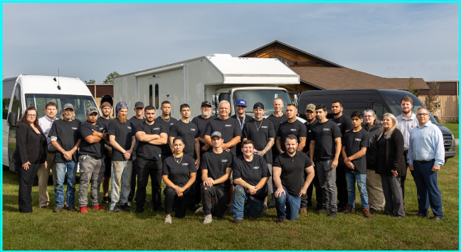 Group photo of the TWR Specialty Vehicle team.