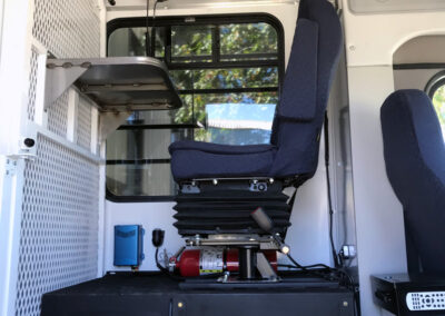 Interior of prisoner bus guard station seat.