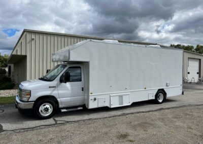 Exterior of white pet services specialty trailer.