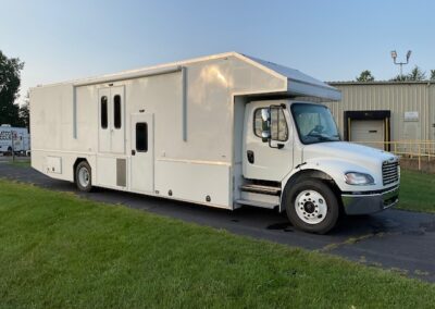 Exterior image of white custom body specialty trailer.