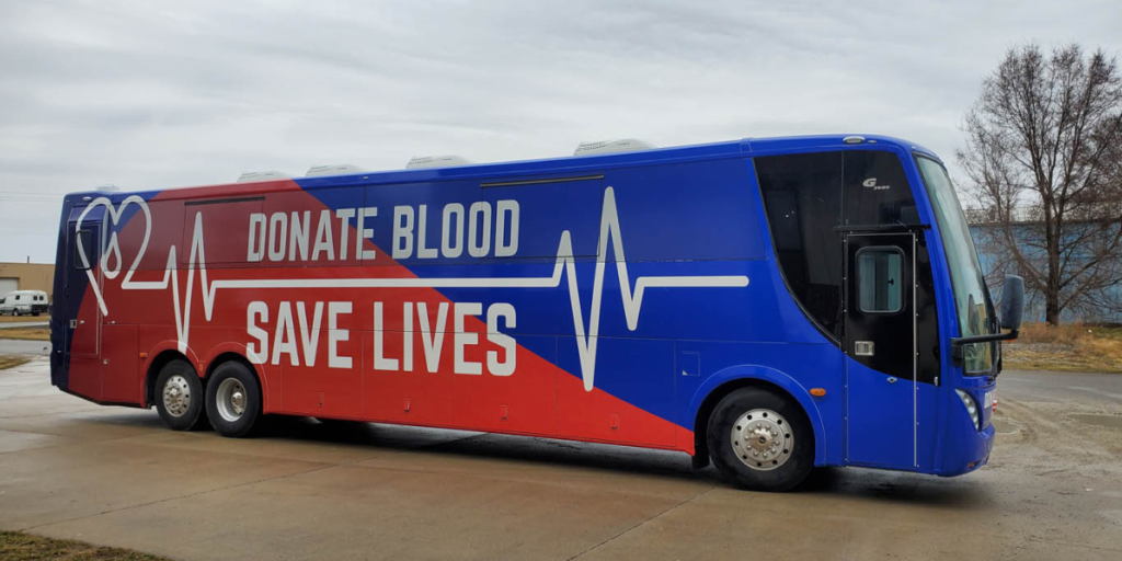 blood mobile specialty vehicles that says donate blood save lives