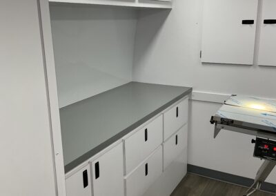 Exam table and white cabinets