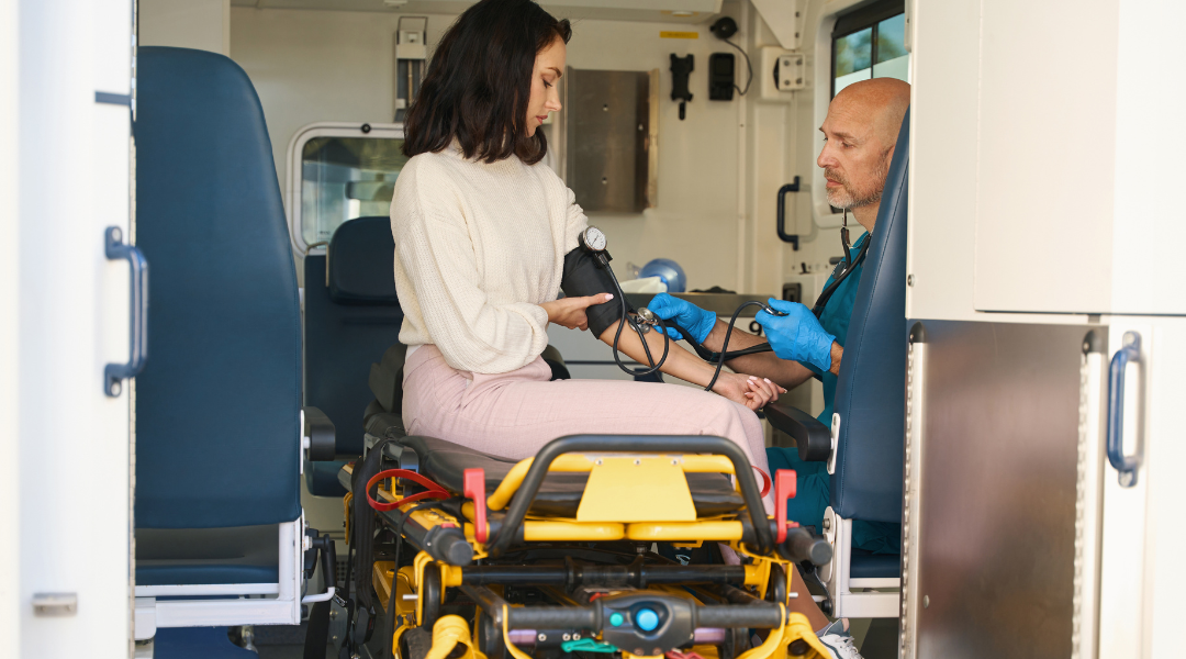 doctor measure patient blood pressure in a medical mobile unit