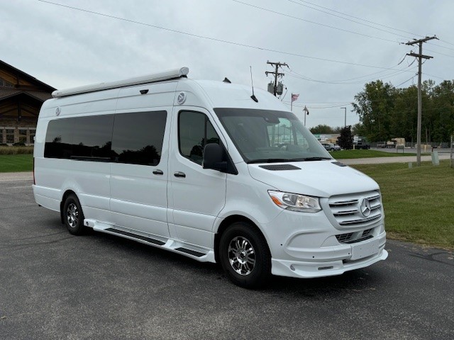 Exterior image of black personal cruiser with awning displayed.